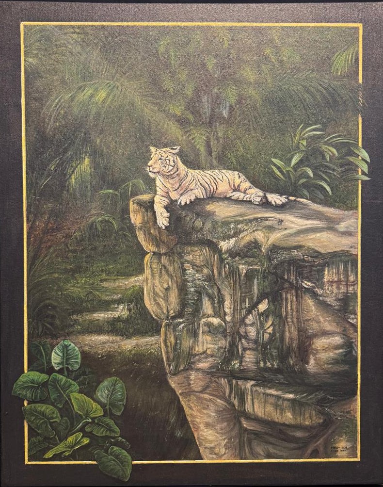 A white tiger lying on a rock ledge in a misty jungle, with leaves breaking over a painted gold-lined border